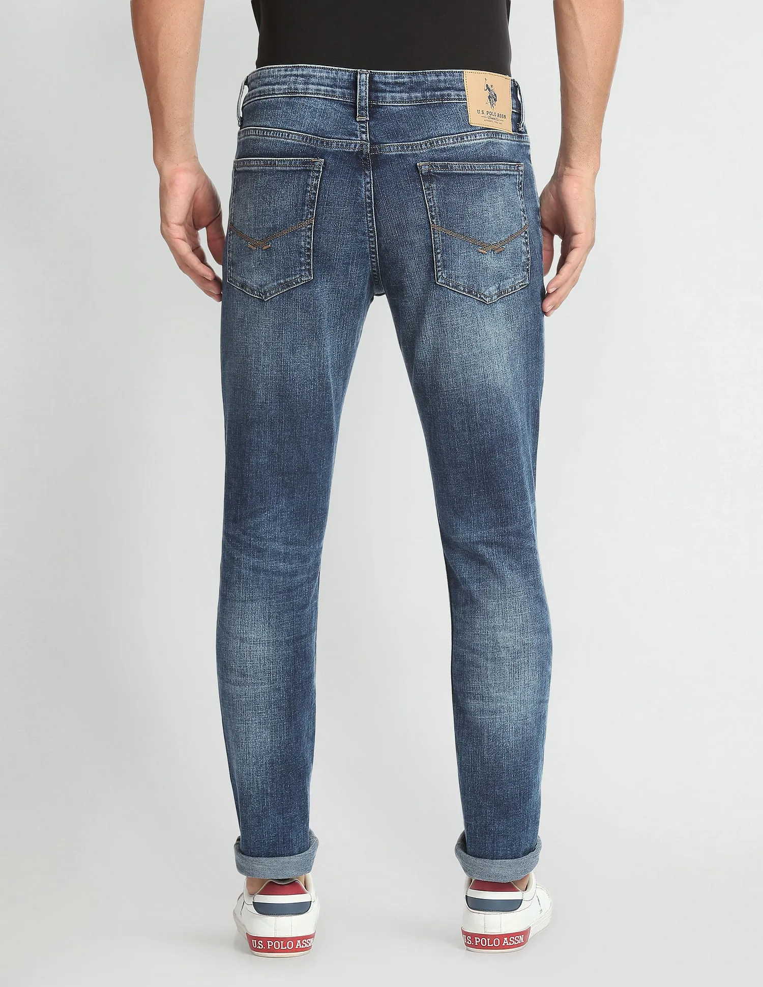 Lightly Distressed Slim Tapered Fit Jeans